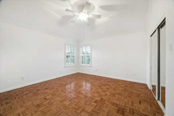 wooden floor in an empty room with a window