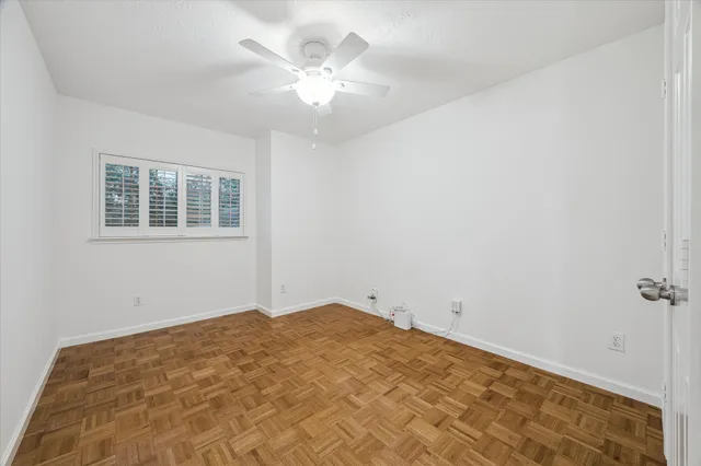 a view of empty room with windows