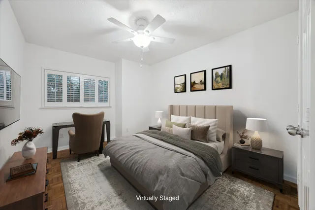 a bedroom with a bed and a chair