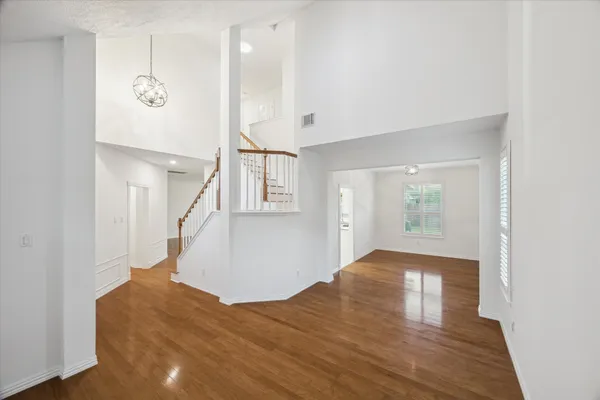 a view of an entryway with wooden floor