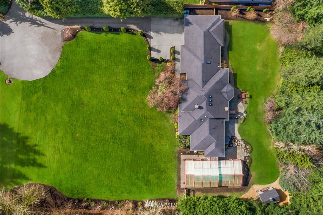 21731 35th Avenue Southeast Bothell, WA 98021 - Photo 2 of 36 an aerial view of house with yard and outdoor seating