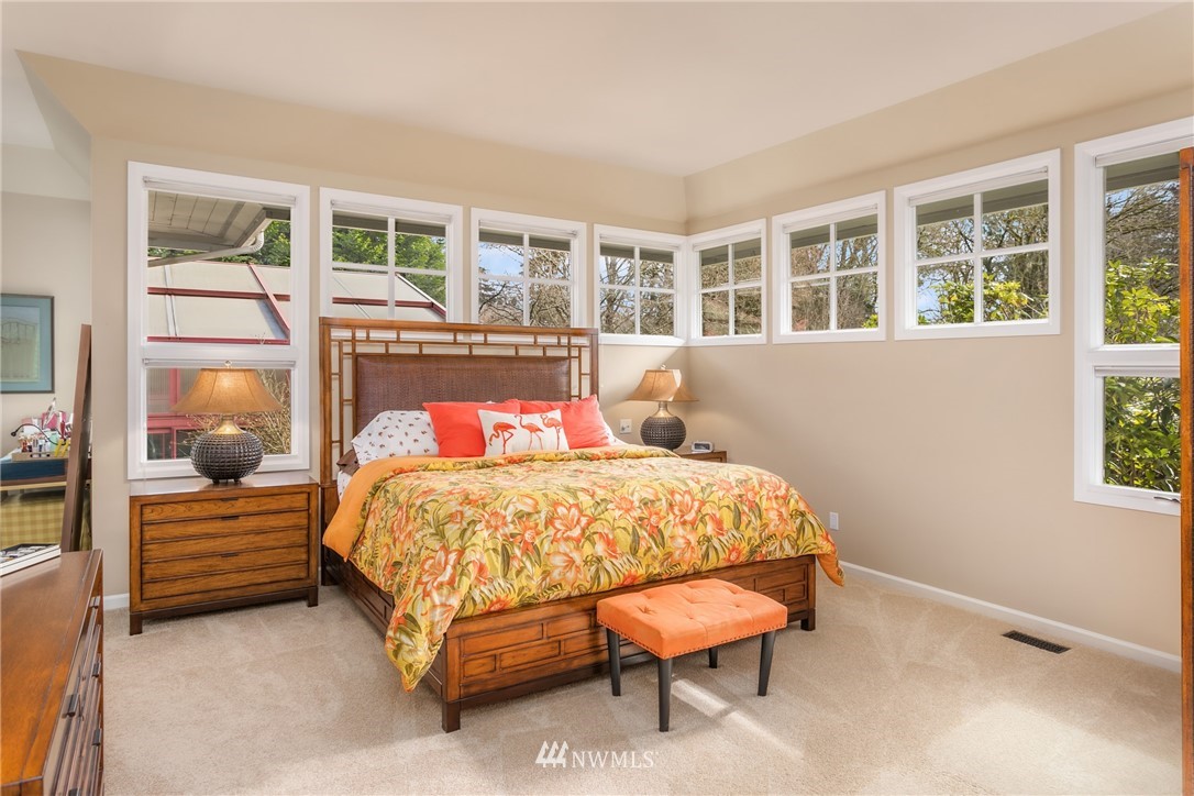 21731 35th Avenue Southeast Bothell, WA 98021 - Photo 15 of 36 a bed sitting in a bedroom next to a window