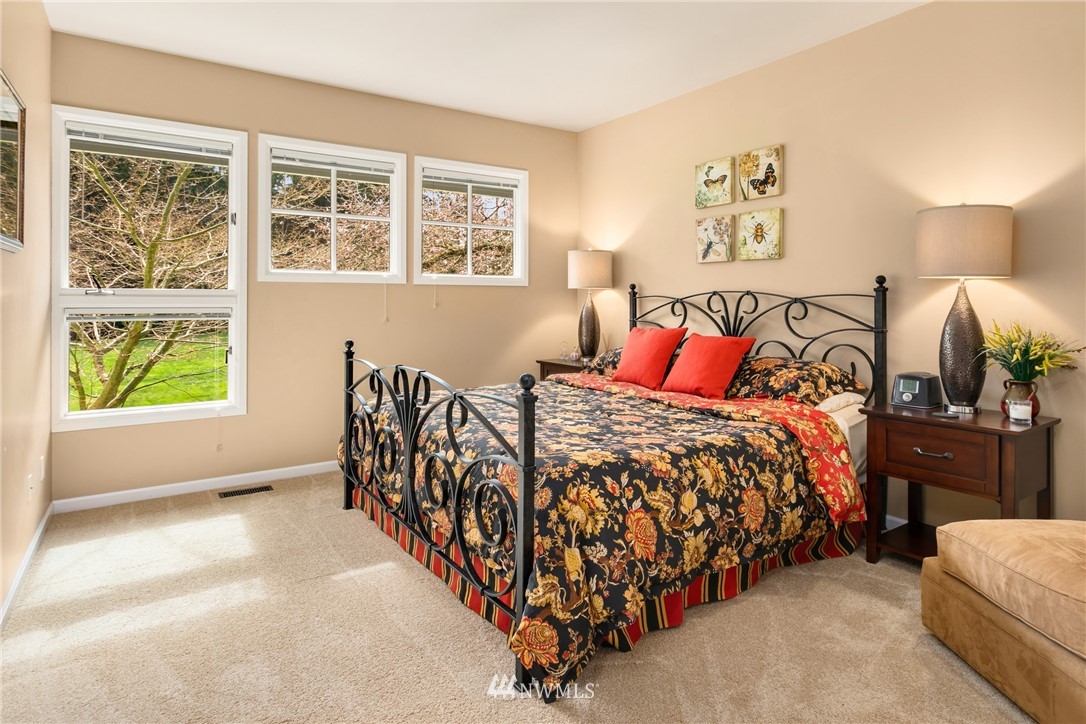 21731 35th Avenue Southeast Bothell, WA 98021 - Photo 19 of 36 a bed sitting in a bedroom next to a window