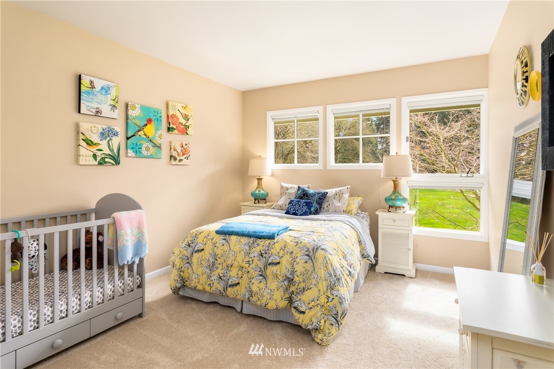 21731 35th Avenue Southeast Bothell, WA 98021 - Photo 20 of 36 a bedroom with a bed and a window