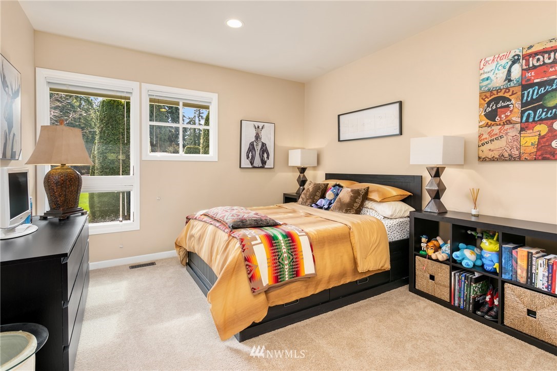 21731 35th Avenue Southeast Bothell, WA 98021 - Photo 24 of 36 a bedroom with a bed and a window