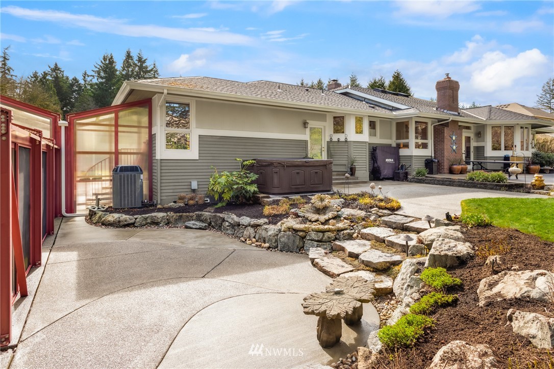 21731 35th Avenue Southeast Bothell, WA 98021 - Photo 30 of 36 a front view of a house with a yard