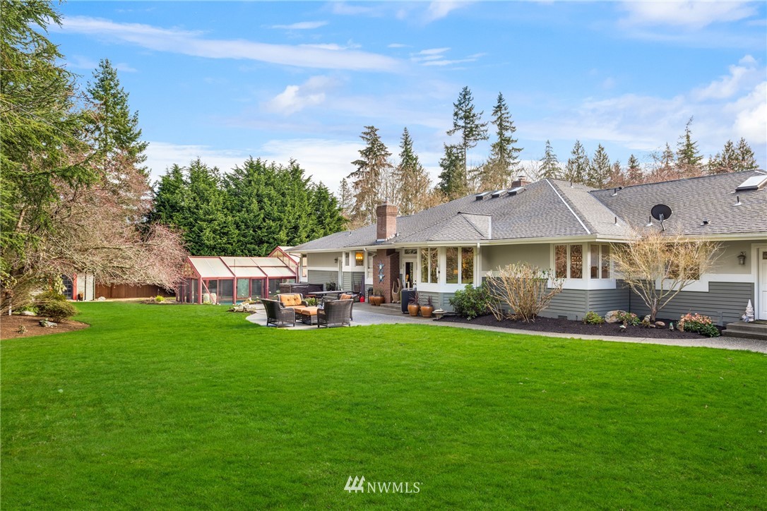21731 35th Avenue Southeast Bothell, WA 98021 - Photo 32 of 36 a front view of a house with a garden