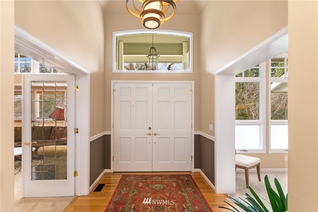 21731 35th Avenue Southeast Bothell, WA 98021 - Photo 5 of 36 a view of a hallway with bathroom and front door
