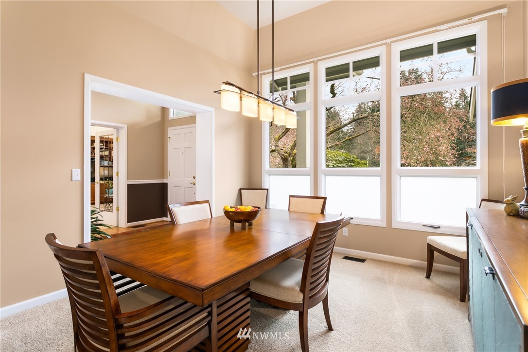 21731 35th Avenue Southeast Bothell, WA 98021 - Photo 7 of 36 a view of a dining room with furniture and a potted plant