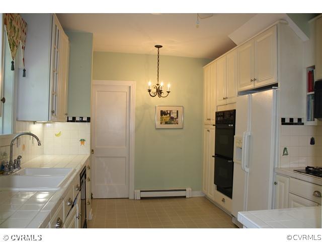 804 Seneca Road Richmond, VA 23226 - Photo 5 of 21 Kitchen - eat-in area and pocket door to laundry/u