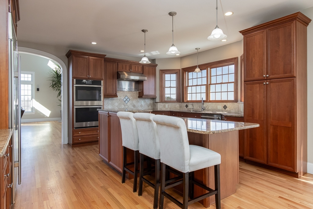 63 Skyfields Drive Groton, MA 01450 - Photo 12 of 40 a large kitchen with a table and chairs