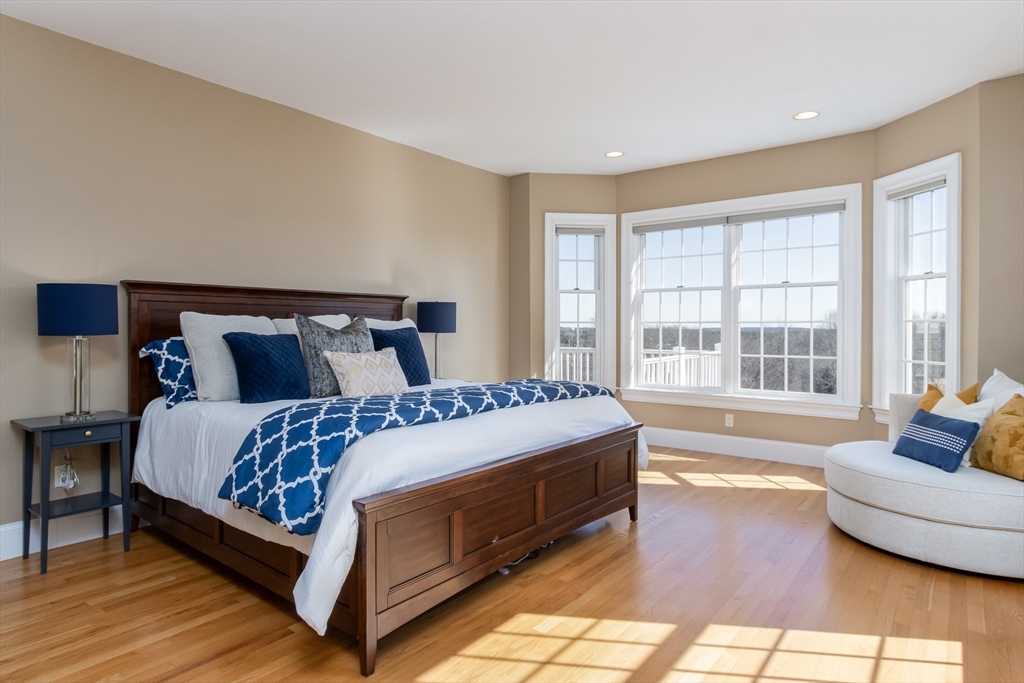 63 Skyfields Drive Groton, MA 01450 - Photo 15 of 40 a bed sitting in a bedroom next to a window