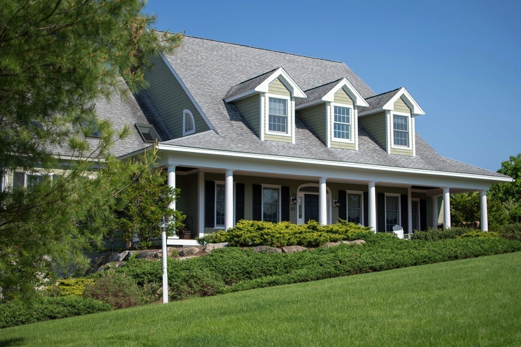 63 Skyfields Drive Groton, MA 01450 - Photo 27 of 40 a front view of a house with a yard