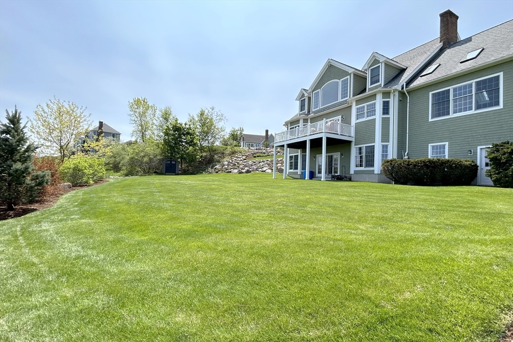 63 Skyfields Drive Groton, MA 01450 - Photo 33 of 40 a view of a house with a yard