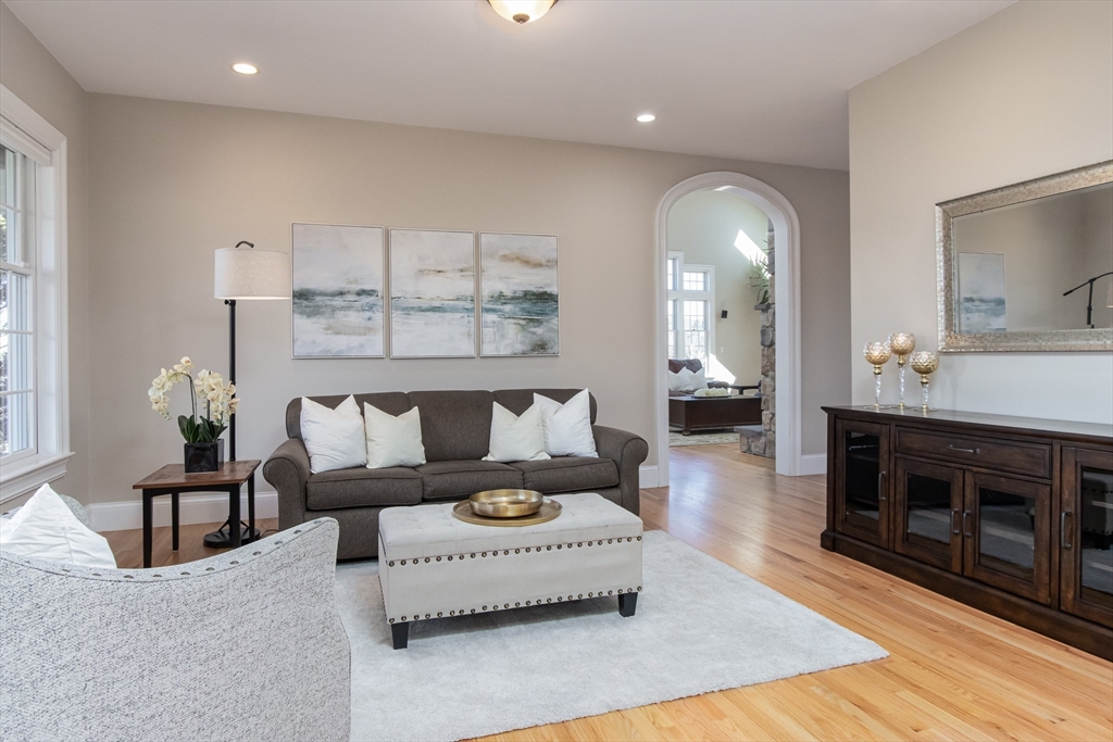 63 Skyfields Drive Groton, MA 01450 - Photo 5 of 40 a living room with furniture and a fireplace