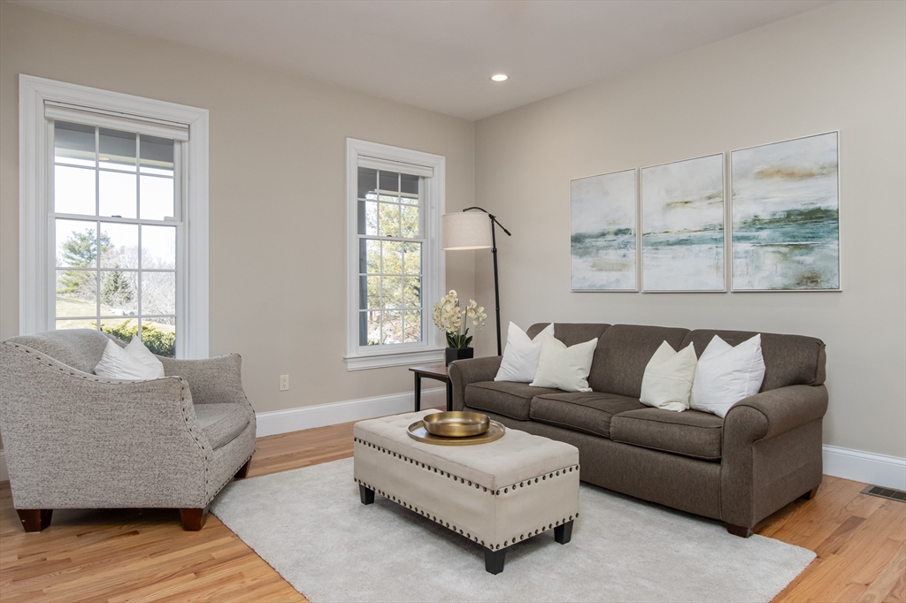 63 Skyfields Drive Groton, MA 01450 - Photo 6 of 40 a living room with furniture and a large window