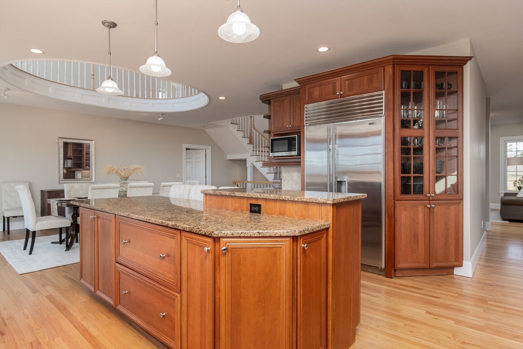 63 Skyfields Drive Groton, MA 01450 - Photo 10 of 40 a kitchen with stainless steel appliances granite countertop a sink and a refrigerator