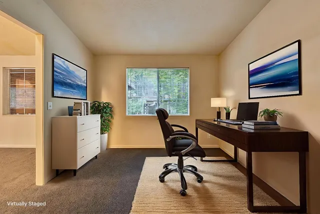 a workspace with furniture and a window