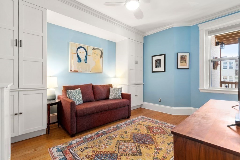 10 Kilsyth Road, Unit 2 Brookline, MA 02445 - Photo 12 of 21 a bedroom with a bed and wooden floor