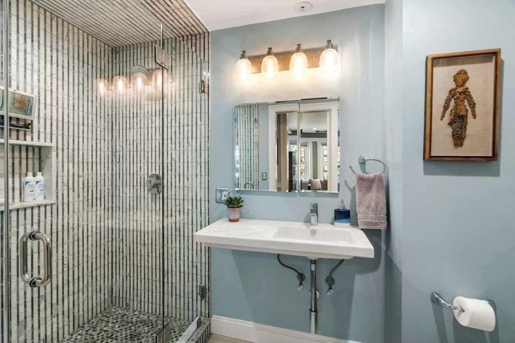 10 Kilsyth Road, Unit 2 Brookline, MA 02445 - Photo 14 of 21 a bathroom with a sink a mirror and shower