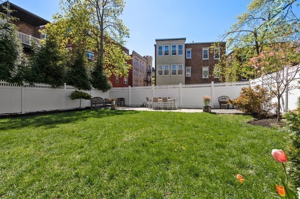 10 Kilsyth Road, Unit 2 Brookline, MA 02445 - Photo 18 of 21 a view of a house with a back yard