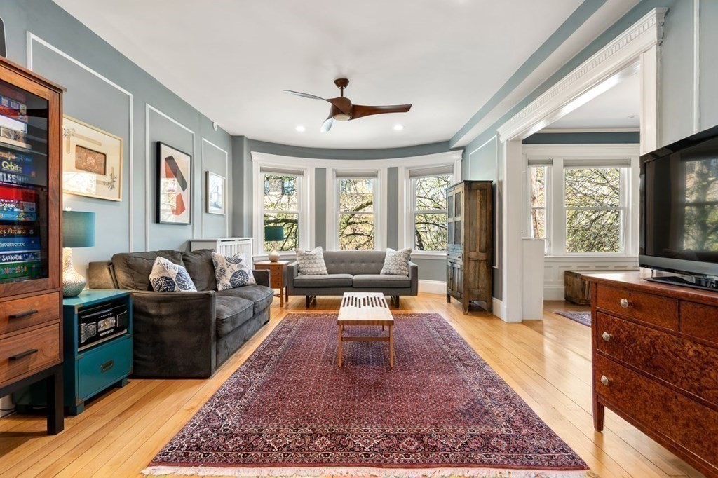 10 Kilsyth Road, Unit 2 Brookline, MA 02445 - Photo 3 of 21 a living room with furniture flat screen tv and a large window
