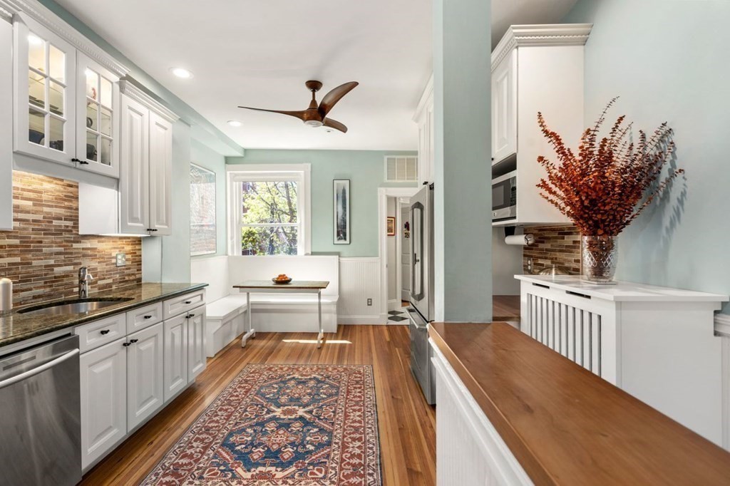 10 Kilsyth Road, Unit 2 Brookline, MA 02445 - Photo 6 of 21 a large kitchen with stainless steel appliances a large window in it