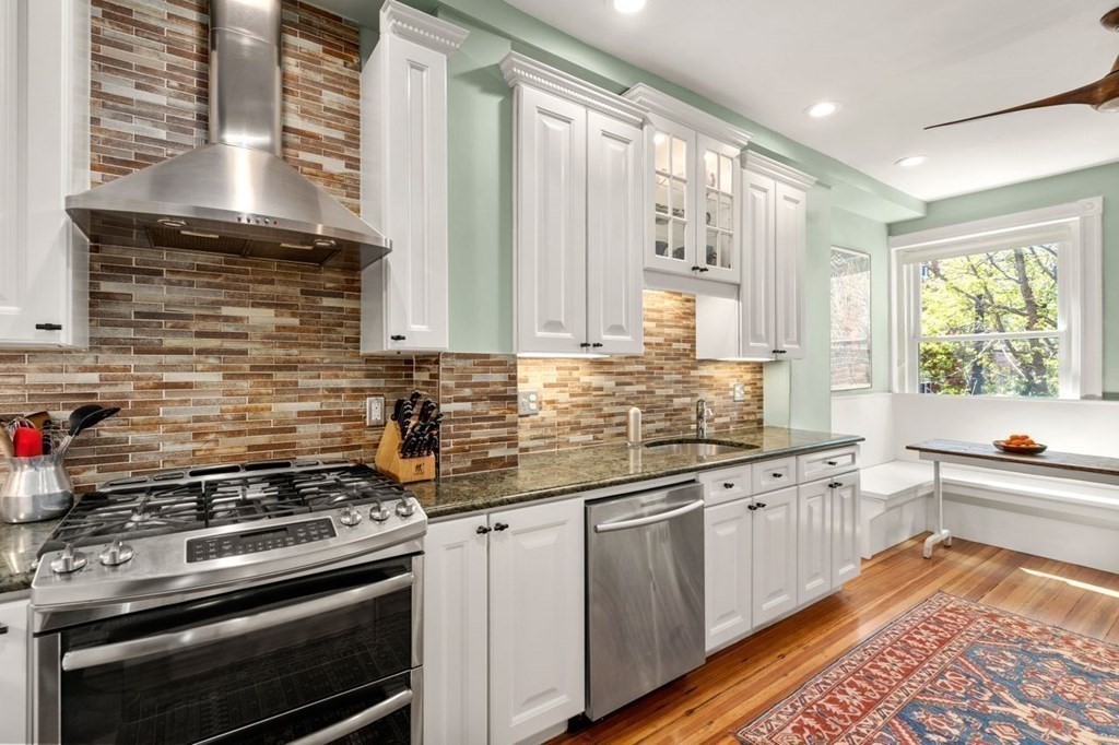 10 Kilsyth Road, Unit 2 Brookline, MA 02445 - Photo 7 of 21 a kitchen with stainless steel appliances a stove sink and cabinets