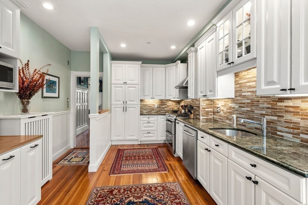 10 Kilsyth Road, Unit 2 Brookline, MA 02445 - Photo 8 of 21 a kitchen with stainless steel appliances a stove a sink and a refrigerator