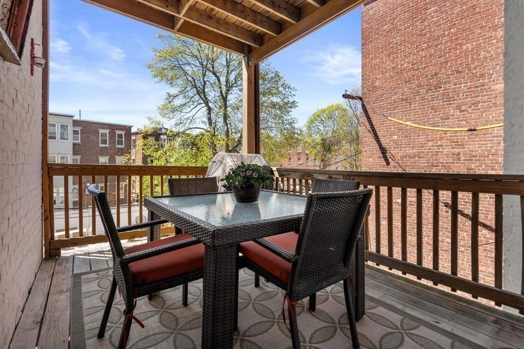 10 Kilsyth Road, Unit 2 Brookline, MA 02445 - Photo 9 of 21 a view of a balcony with furniture