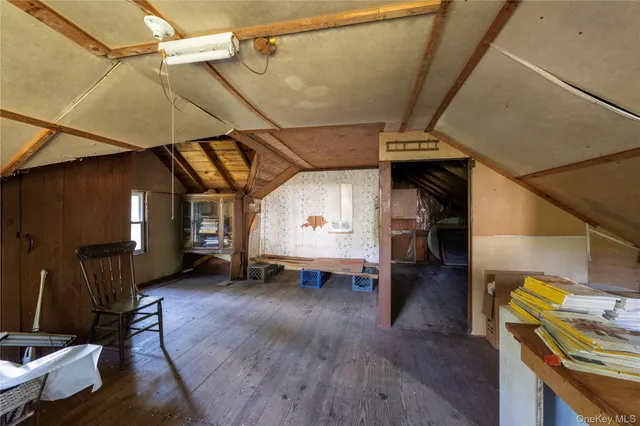 a view of a room with wooden floor barbeque oven table and chairs
