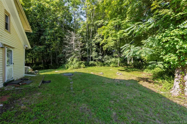 a view of swimming pool with a yard