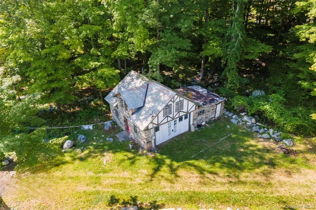 a wooden bench sitting in the middle of a forest