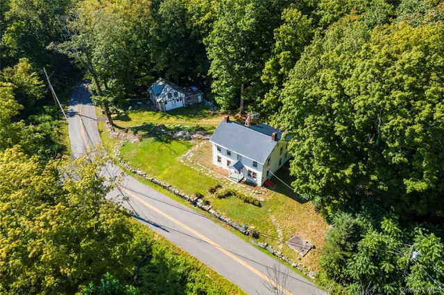 an aerial view of a house with a garden