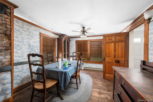 a view of a dining room with furniture and window