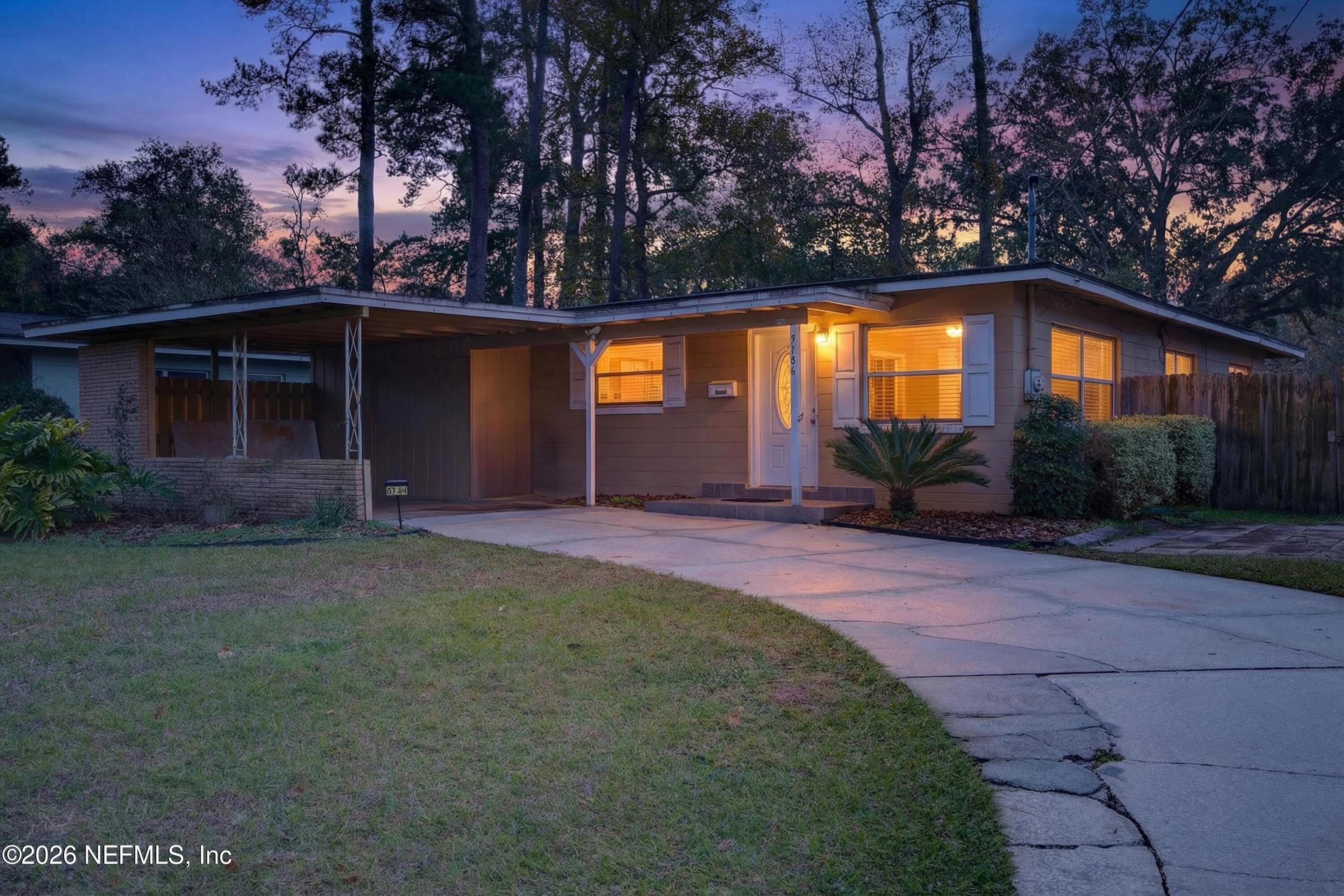 5134 Damascus Road South Jacksonville, FL 32207 - Photo 1 of 41 a front view of a house with garden