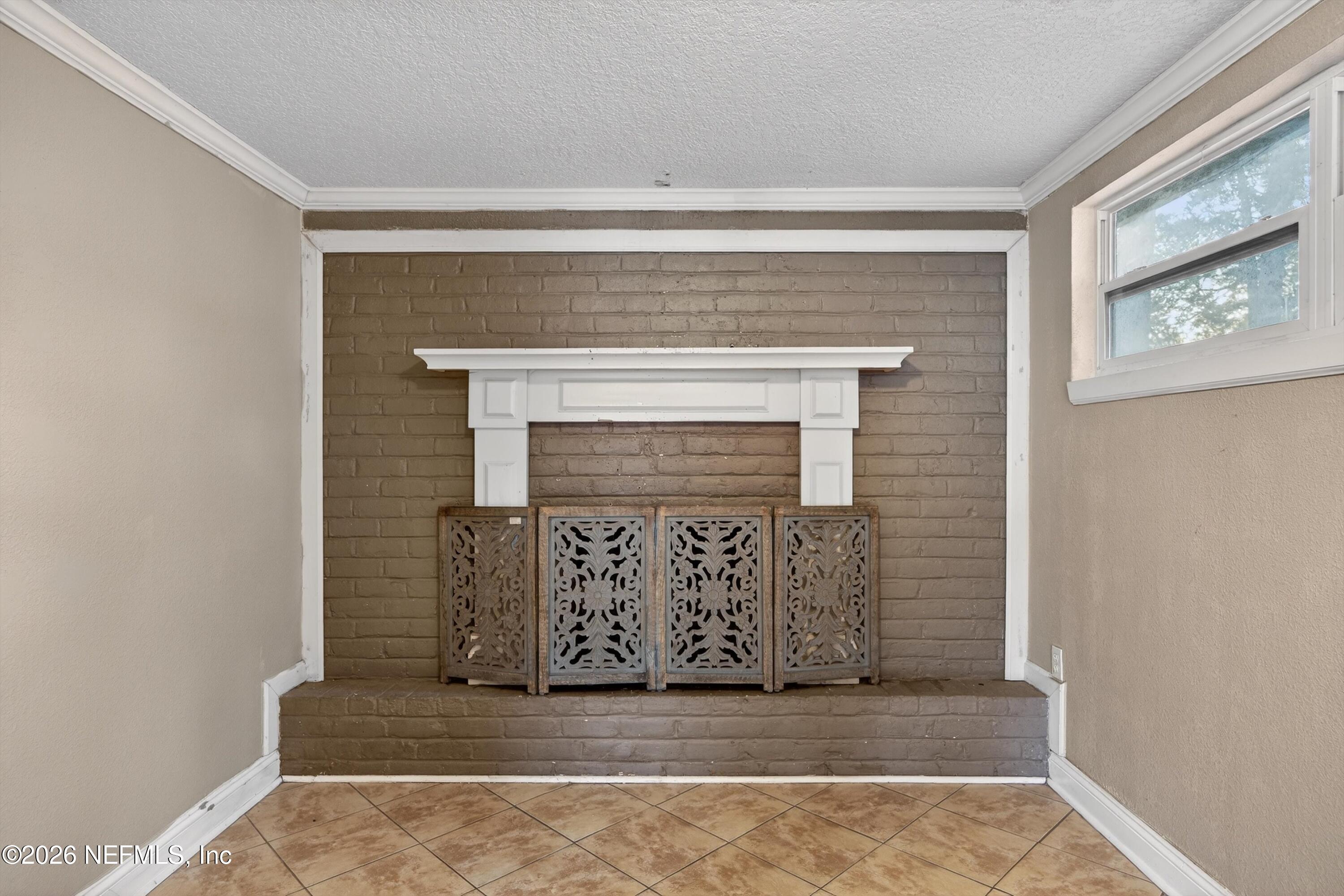 5134 Damascus Road South Jacksonville, FL 32207 - Photo 12 of 41 a view of fireplace and window in an empty room