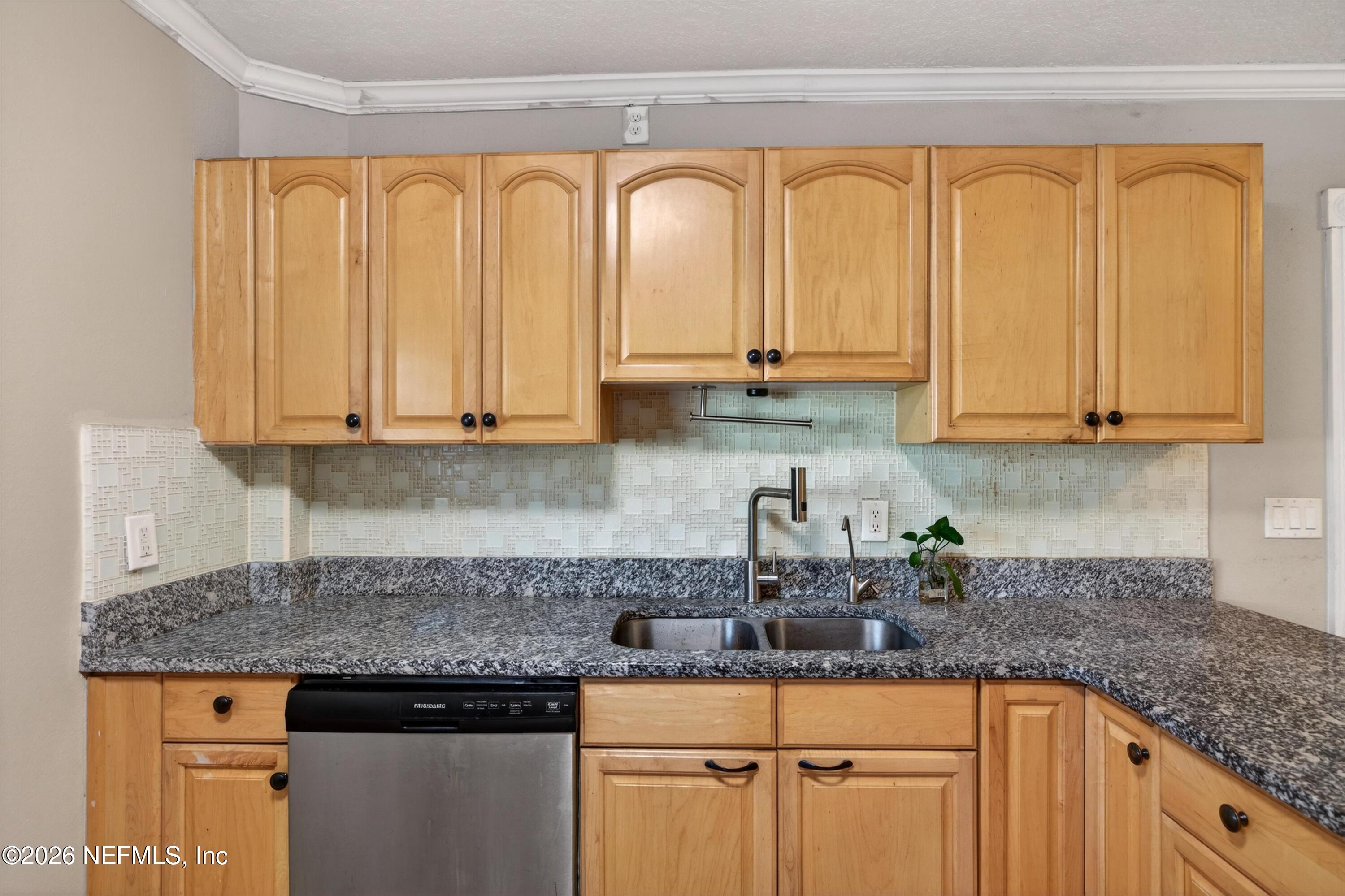 5134 Damascus Road South Jacksonville, FL 32207 - Photo 16 of 41 a kitchen with stainless steel appliances granite countertop a sink a stove and cabinets