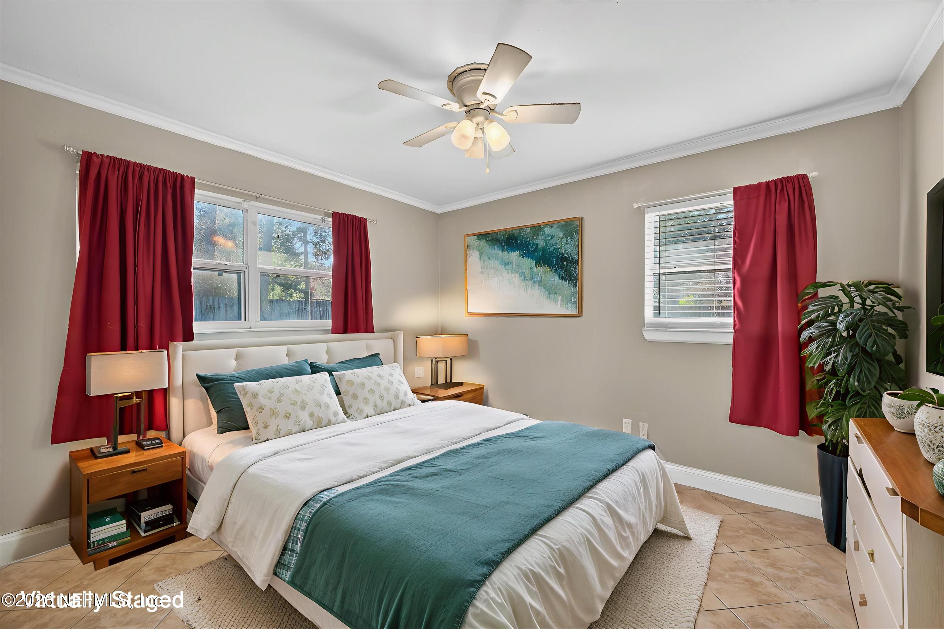 5134 Damascus Road South Jacksonville, FL 32207 - Photo 18 of 41 a bedroom with a bed and a chandelier