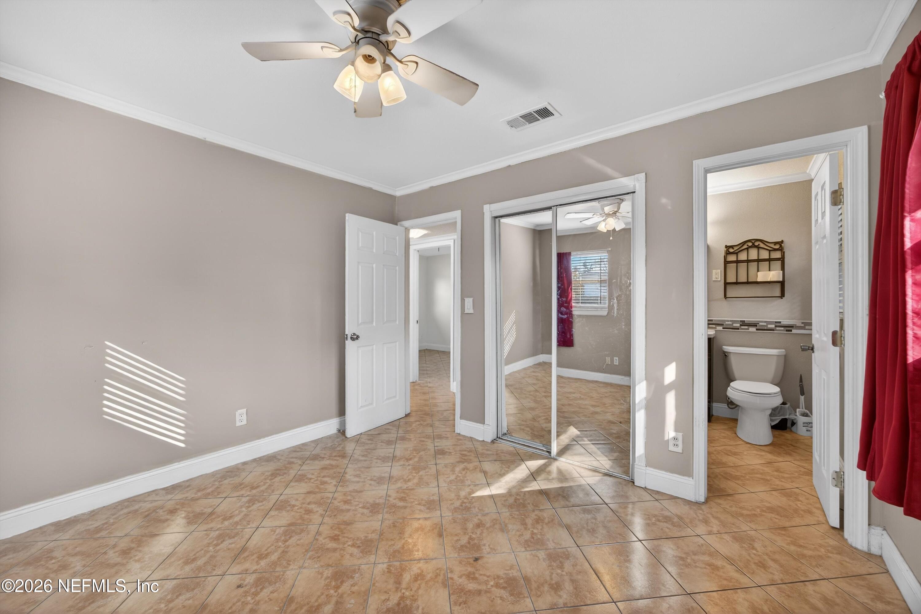 5134 Damascus Road South Jacksonville, FL 32207 - Photo 21 of 41 a view of an entryway with wooden floor and a bedroom