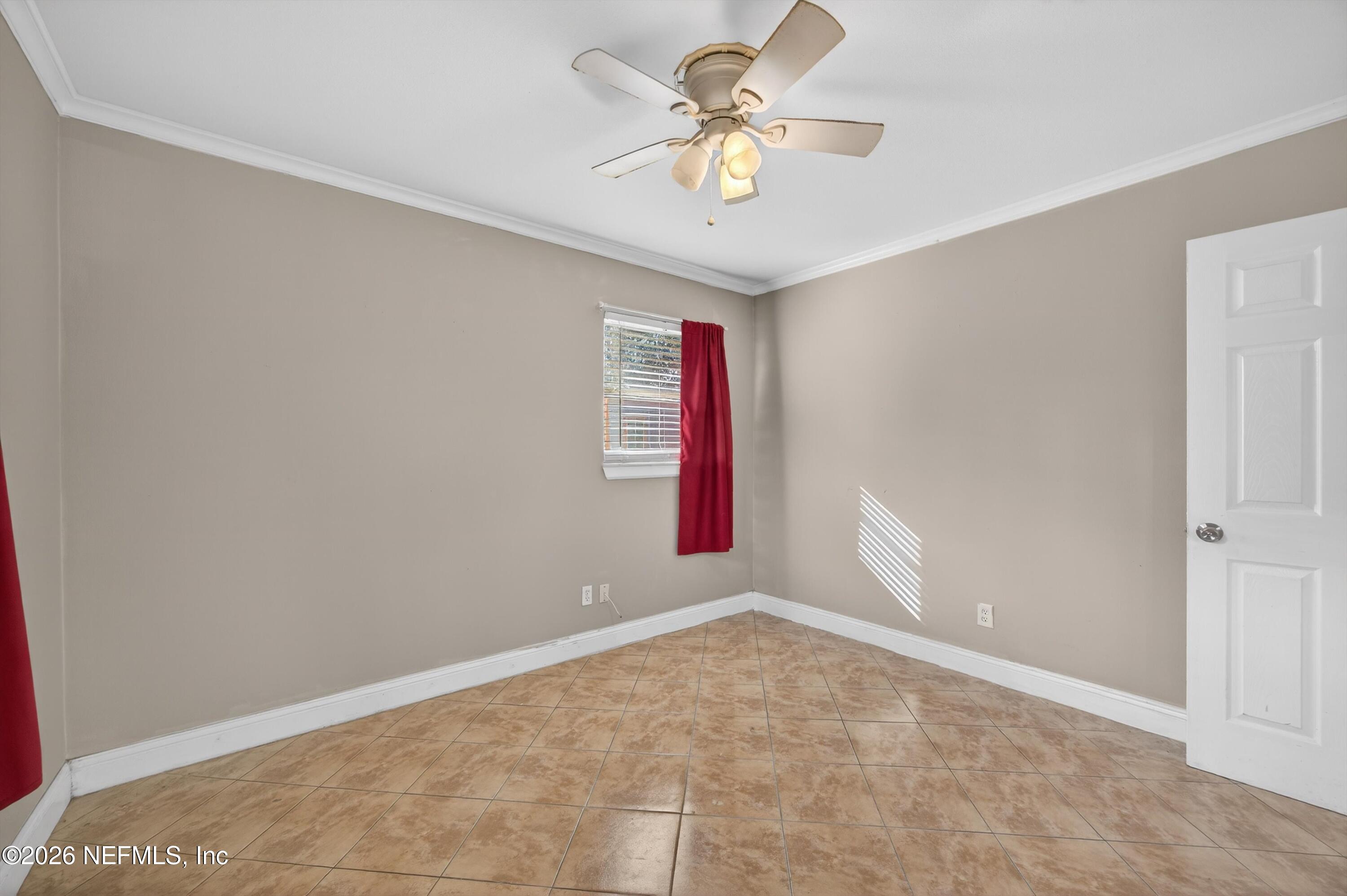 5134 Damascus Road South Jacksonville, FL 32207 - Photo 22 of 41 an empty room with windows and fan