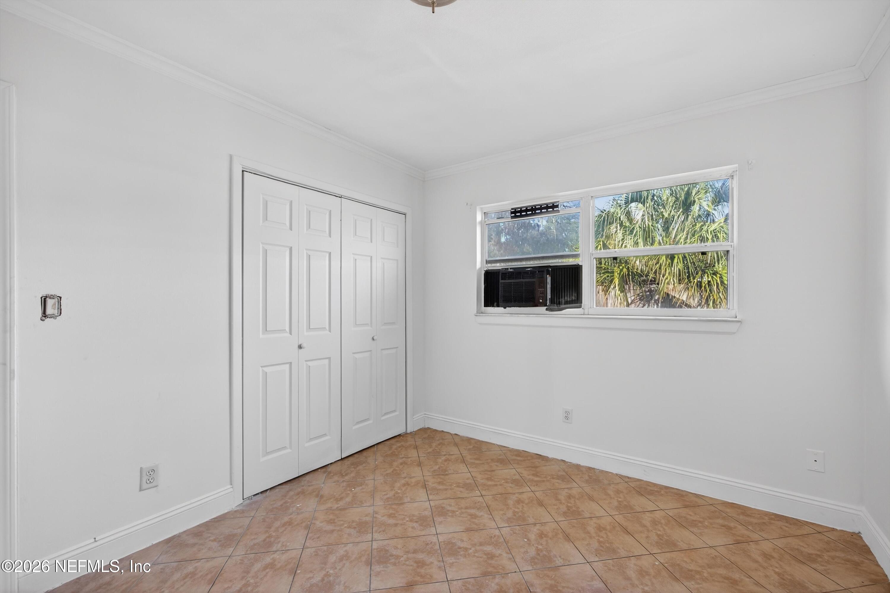 5134 Damascus Road South Jacksonville, FL 32207 - Photo 26 of 41 a view of empty room with window and fireplace