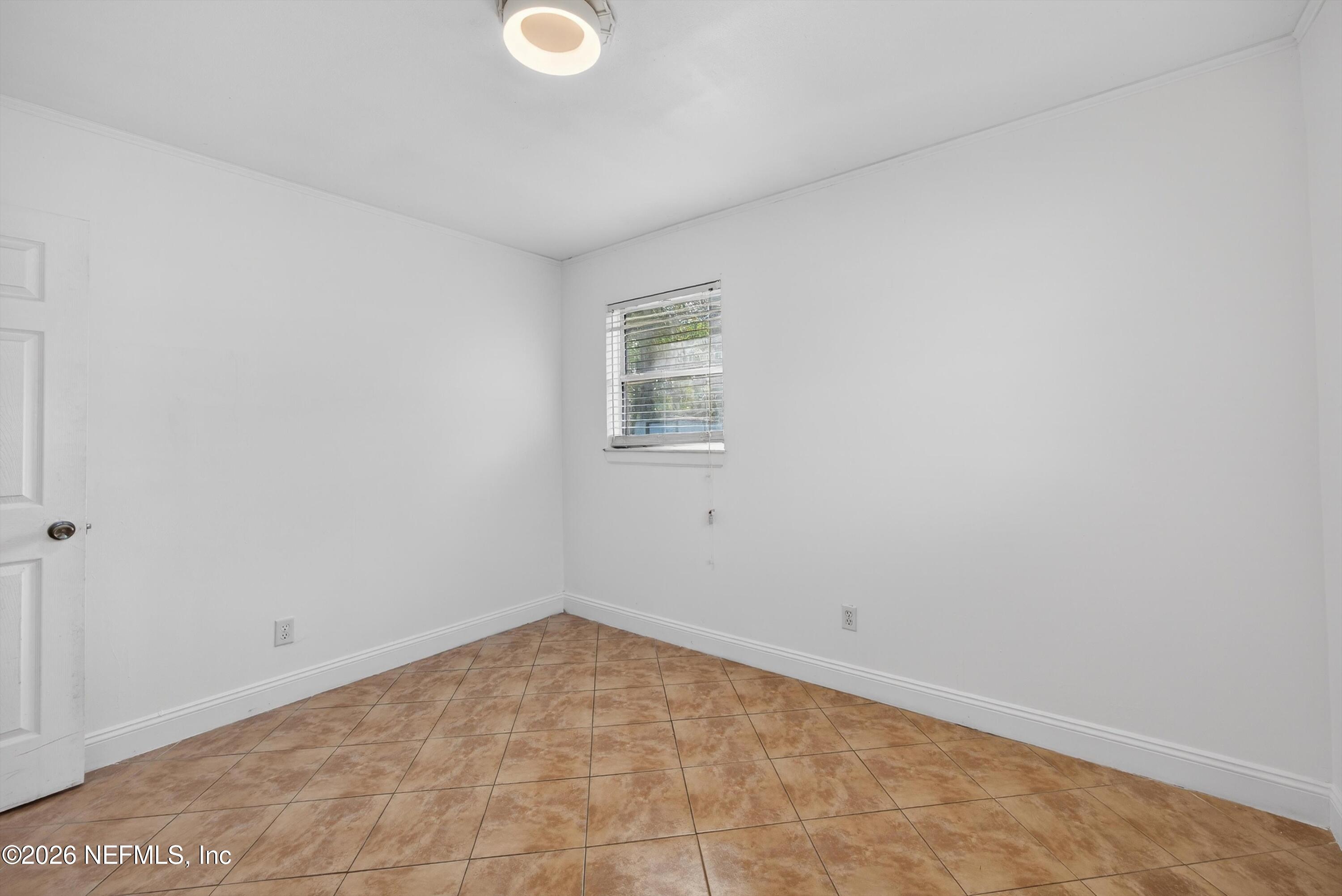 5134 Damascus Road South Jacksonville, FL 32207 - Photo 34 of 41 an empty room with a window