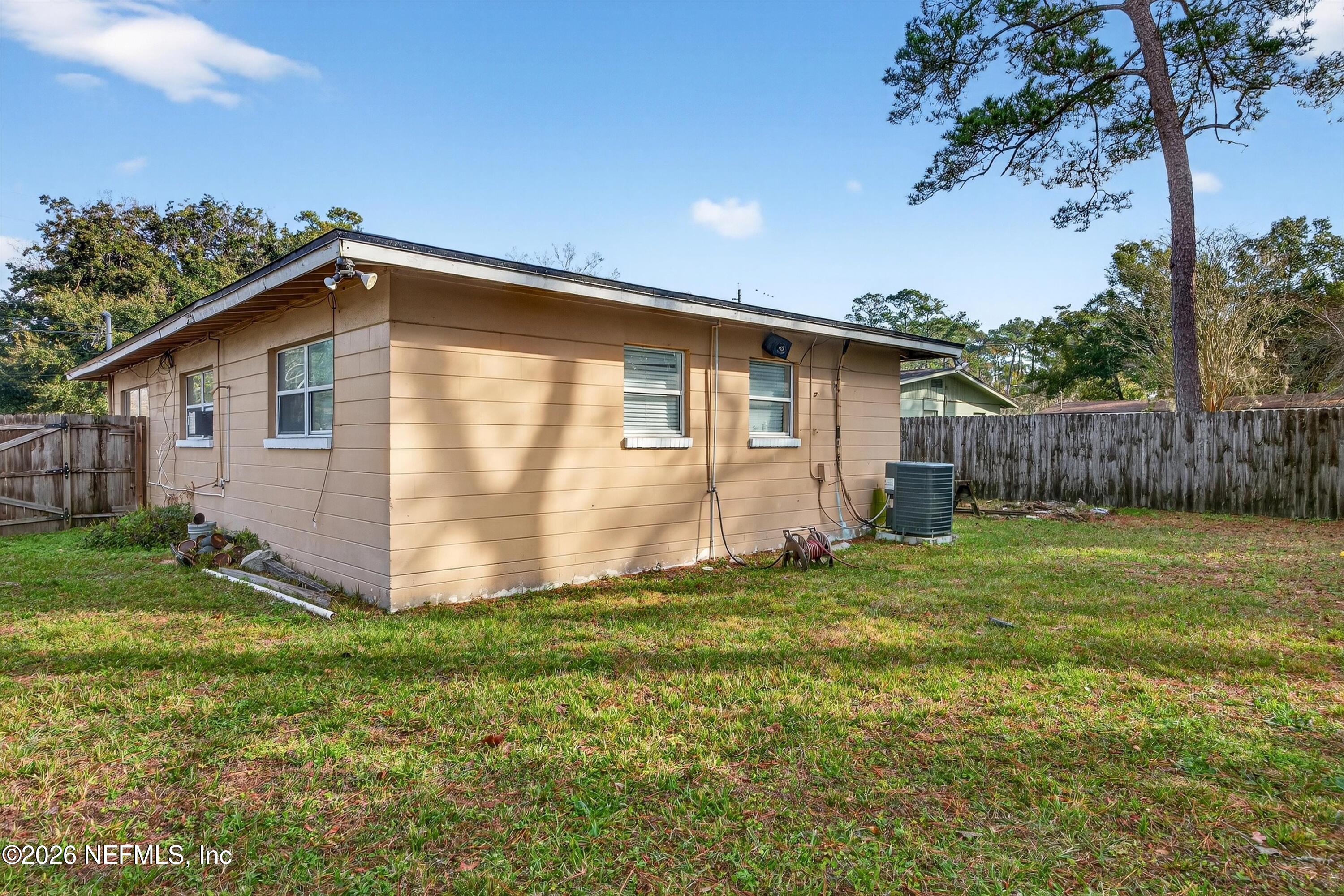 5134 Damascus Road South Jacksonville, FL 32207 - Photo 38 of 41 a view of a backyard with potted plants and large tree