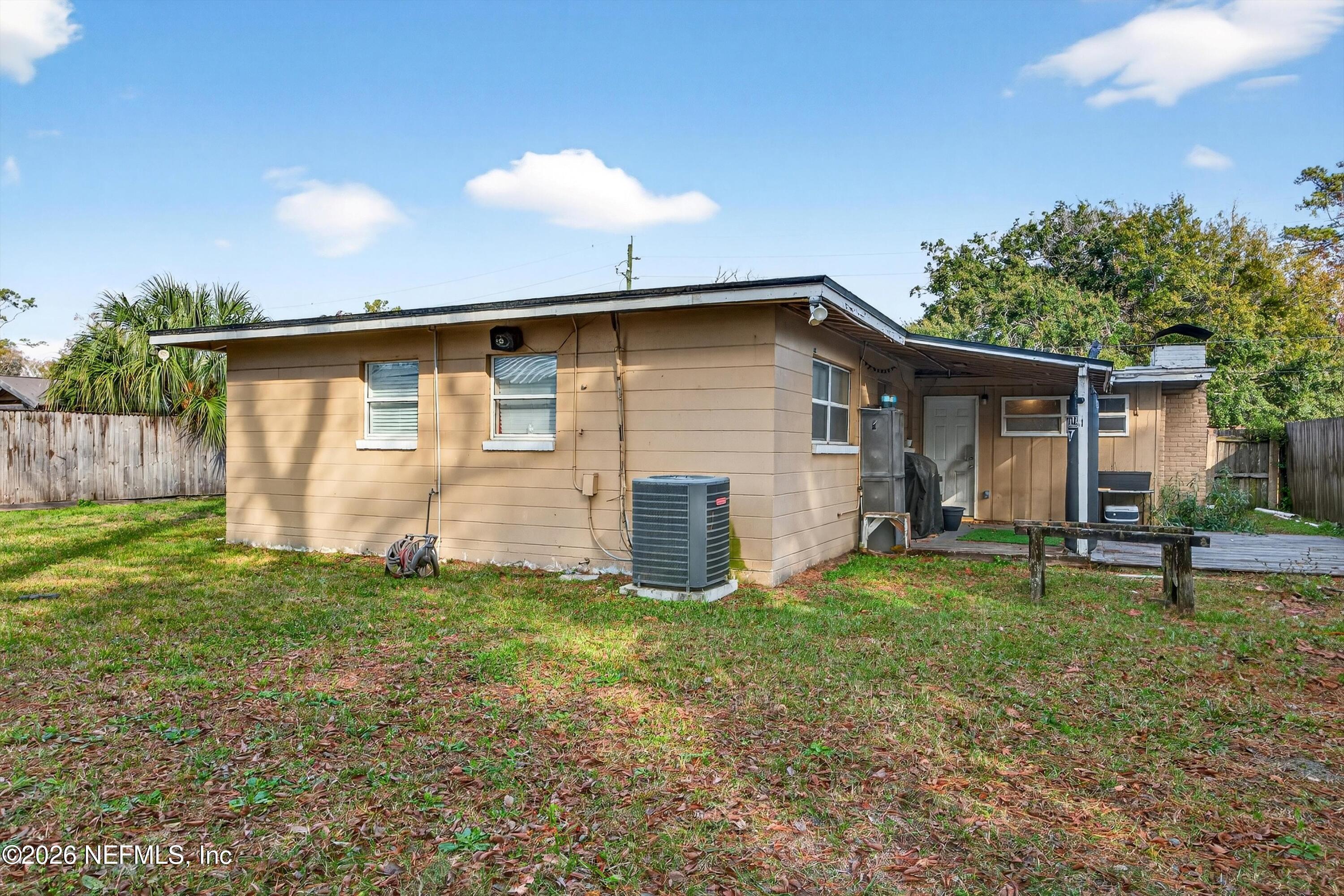 5134 Damascus Road South Jacksonville, FL 32207 - Photo 40 of 41 a view of a house with backyard and a tree