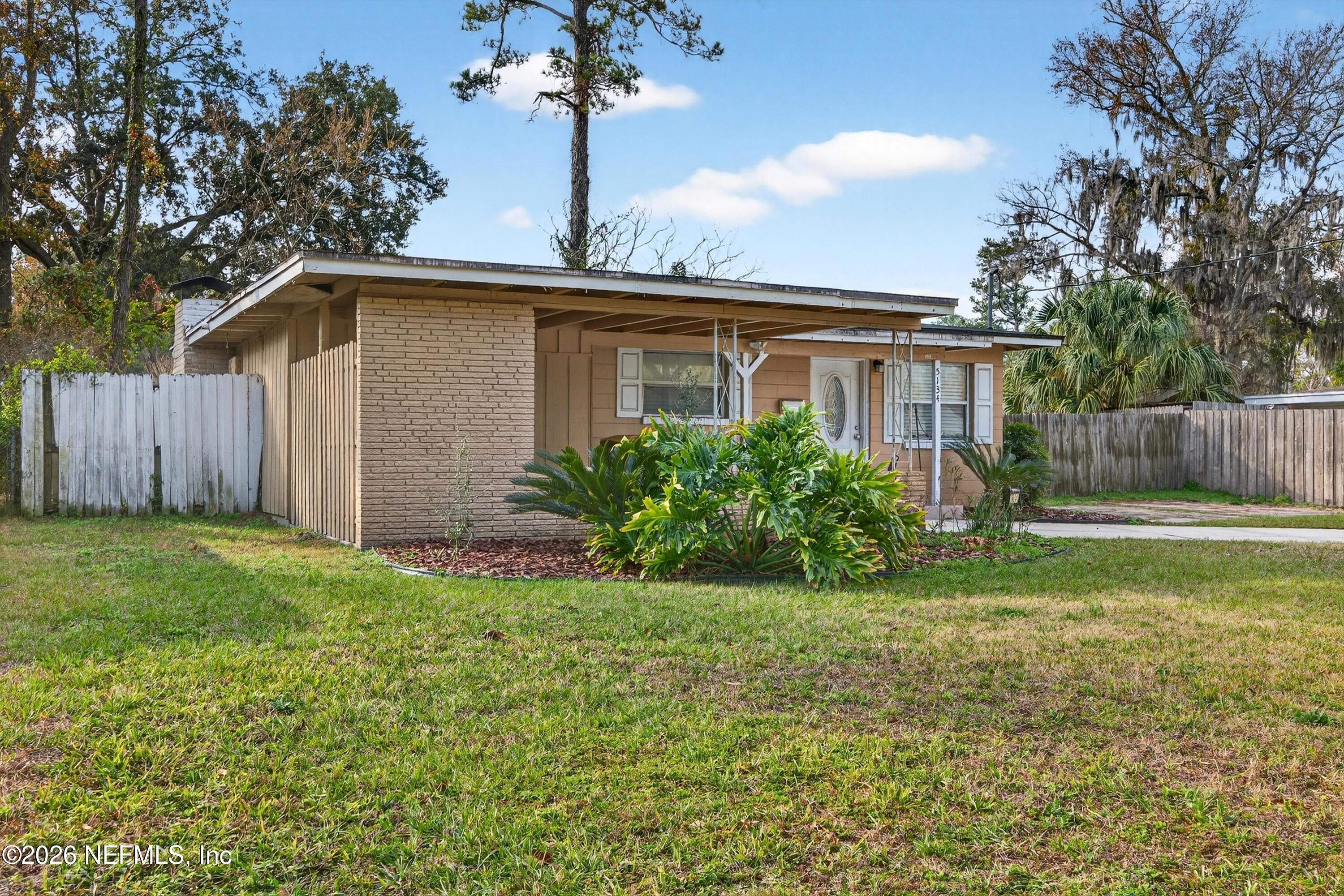 5134 Damascus Road South Jacksonville, FL 32207 - Photo 4 of 41 a front view of a house with garden