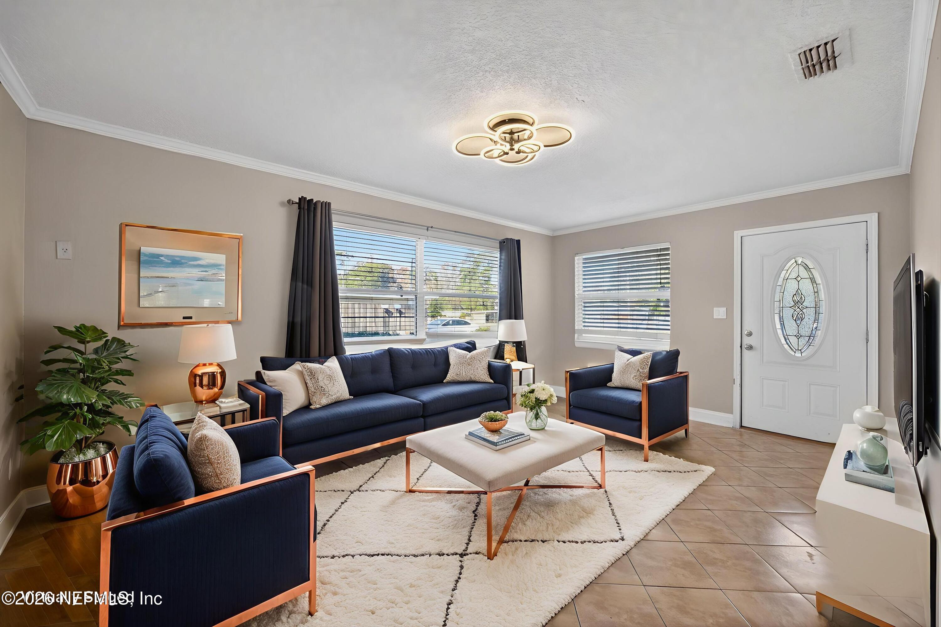 5134 Damascus Road South Jacksonville, FL 32207 - Photo 5 of 41 a living room with furniture potted plant and a window