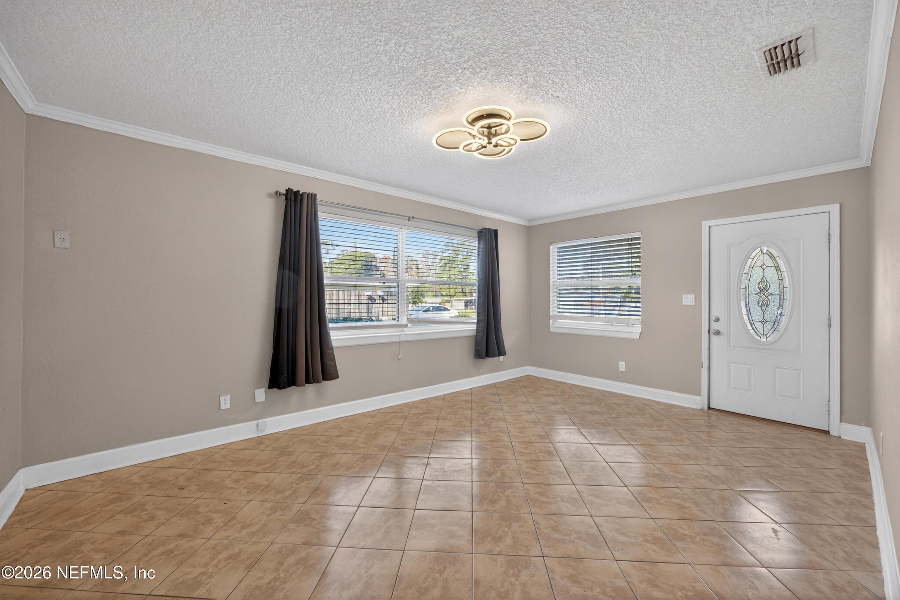 5134 Damascus Road South Jacksonville, FL 32207 - Photo 6 of 41 a view of an empty room with a window