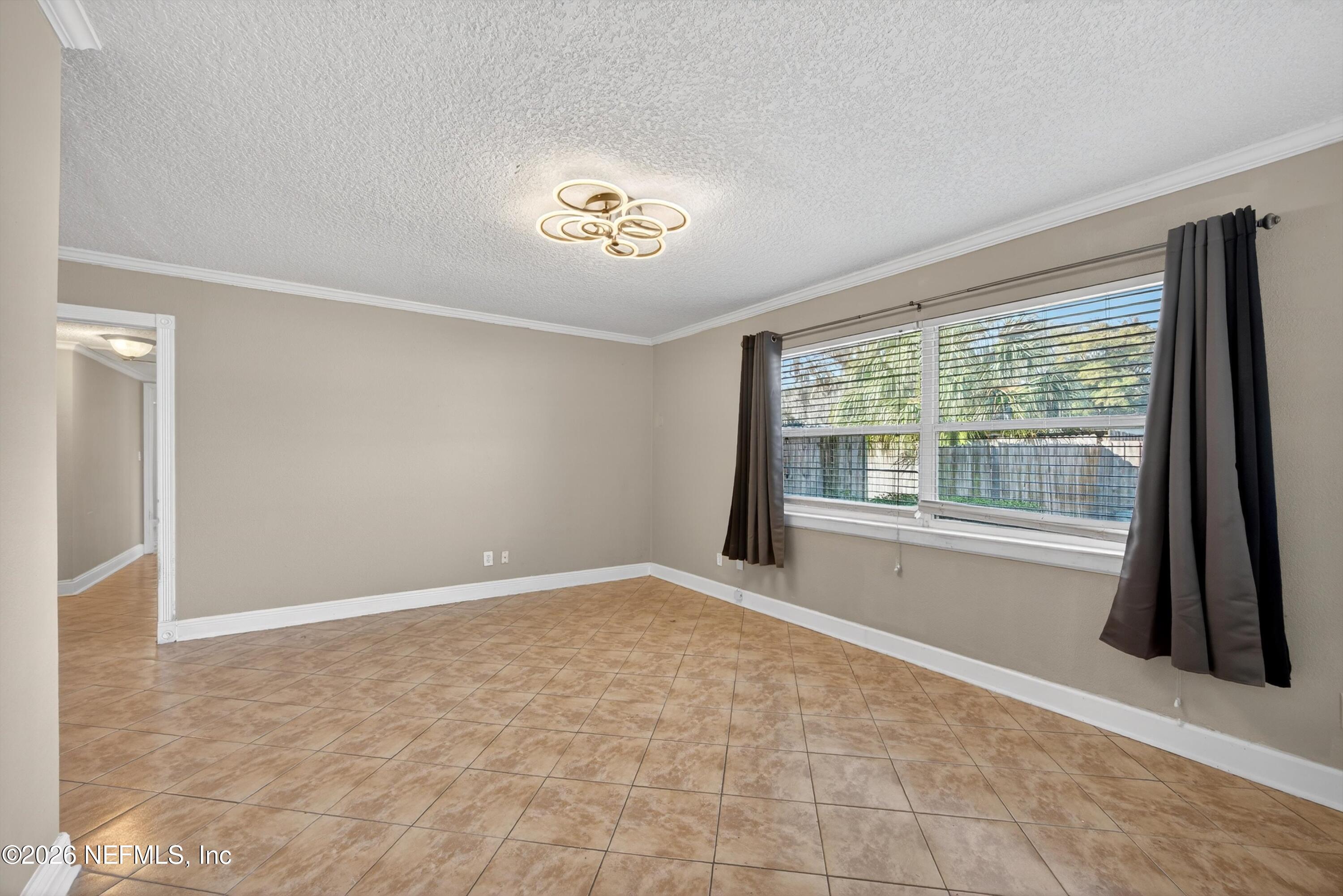 5134 Damascus Road South Jacksonville, FL 32207 - Photo 7 of 41 a view of an empty room with a window