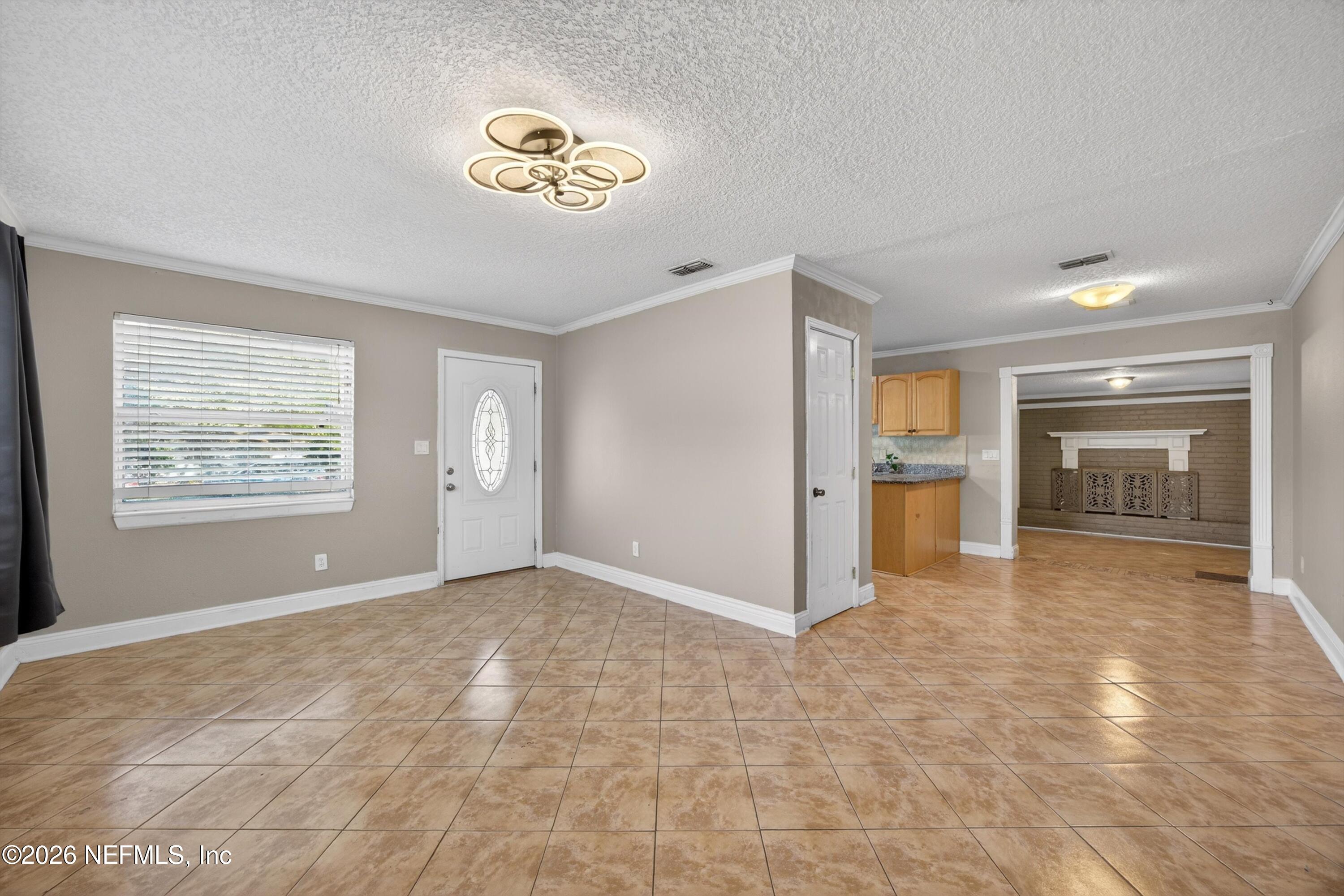 5134 Damascus Road South Jacksonville, FL 32207 - Photo 10 of 41 an empty room with kitchen and windows